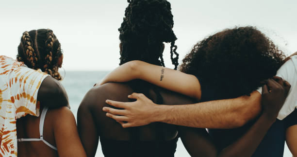 Shot of a group of friends embracing