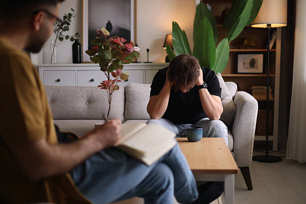 Doctor talks with patient and takes notes